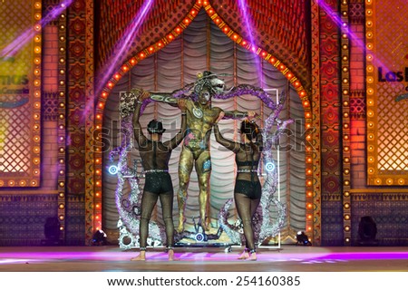 CANARY ISLAND, SPAIN - FEBRUARY 17, 2015: Guzman Gomez Dominguez (m) and his assisters onstage during city of Las Palmas carnival One Thousand and One Nights Body Painting Contest.