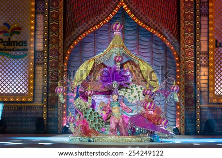 CANARY ISLAND, SPAIN - FEBRUARY 15, 2015: Yanai Cruz Gonzalez onstage with costume from designer Julio Vicente Artiles during city of Las Palmas carnival One Thousand and One Nights Junior Queen Gala.