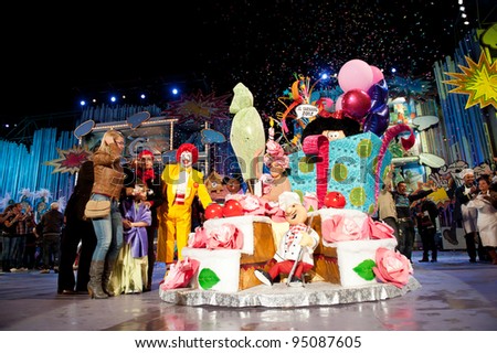 LAS PALMAS, SPAIN- FEBRUARY 12: First prize to Aymara del Pino Rueda, from Canary Islands, onstage  surrounded with unidentified people during The Junior Queen on February 12, 2012 in Las Palmas, Spain