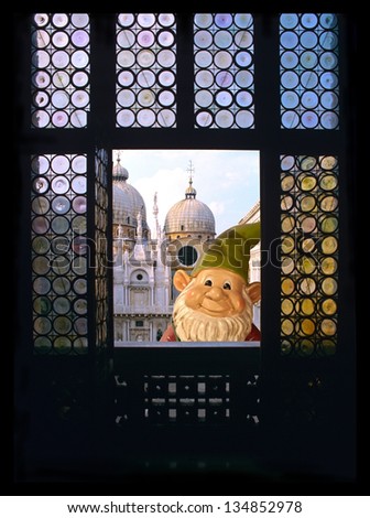 Laughing Gnome in Venice, a happy garden gnome on vacation in Italy