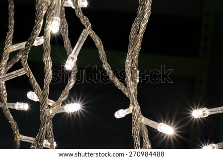 Beautiful defocused LED lights filtered bokeh abstract with warm tone background.