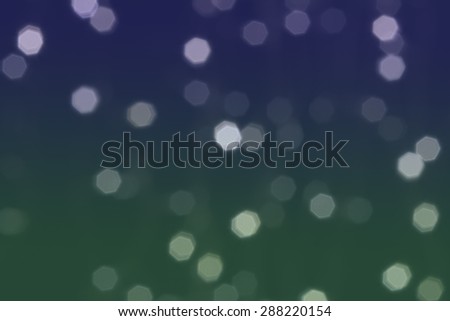 Beautiful defocused LED lights filtered bokeh abstract with blue green tone background.