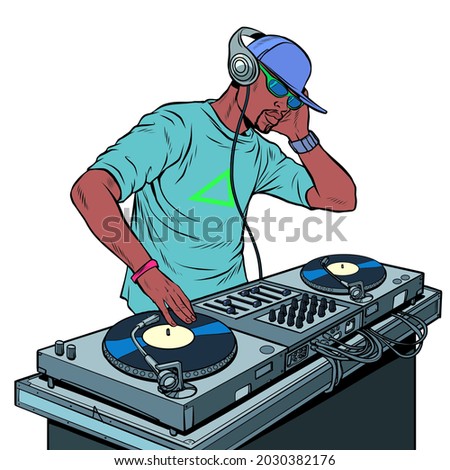 Black man dj on vinyl turntables. concert music performance