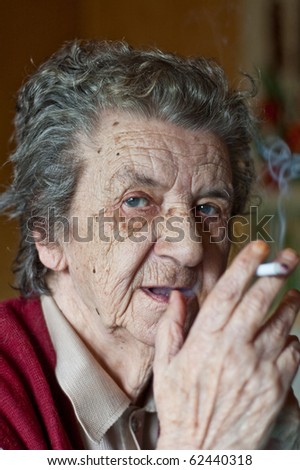 portrait of a old lady smoking a cigar
