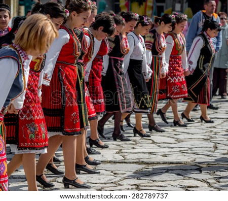 RAZLOG, BULGARIA - APRIL 13, 2015: Female Bulgarian folklore dancers during the traditional folklore festival \