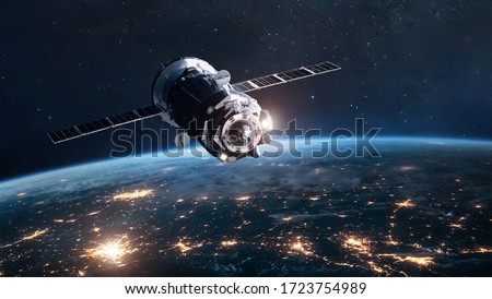 Cargo spaceship on orbit of planet Earth. Expedition on ISS station. Exploration of space. Elements of this image furnished by NASA