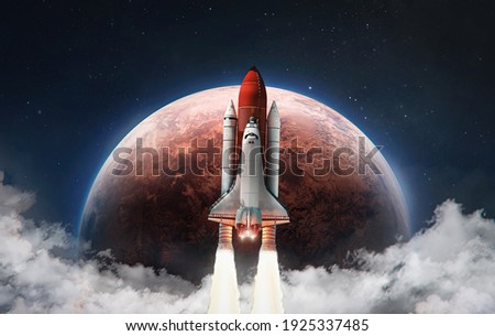 Spaceship in the outer space on orbit of Mars planet. Space shuttle in sky with clouds. Exploration of Red planet. Elements of this image furnished by NASA