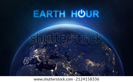 Earth Hour 2022 event. Planet Earth at night in outer space. Turn off your lights for save climate. Elements of this image furnished by NASA  商業照片 © 