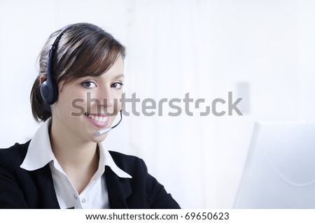 young woman working in office with laptop and headphones, customer service and call center.
