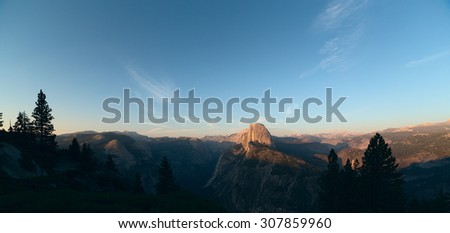 Panoramic view on Half Dome peak in sunset light from Glacier Point trailhead. Sierra Nevada mountains, Yosemite National Park, California