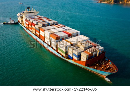 Container ship transporting large cargo logistic to import export goods internationally around the world, including Asia Pacific and Europe, by deep sea Mediterranean Aerial view photograph from drone