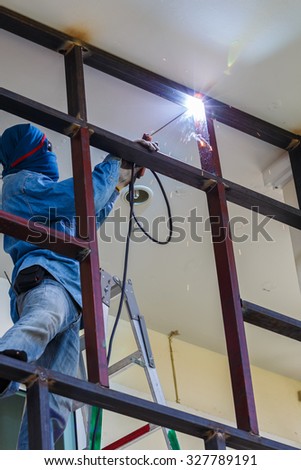 male workers were welding on the high danger no safety