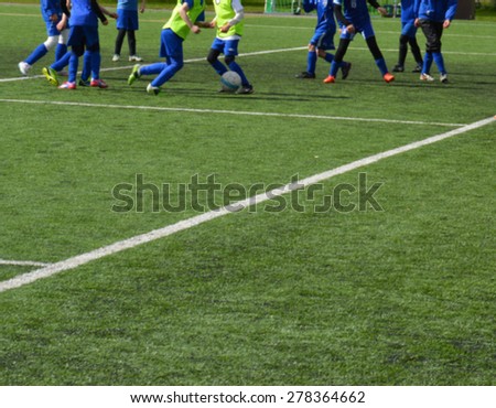 Young female soccer players - European football - blurred image