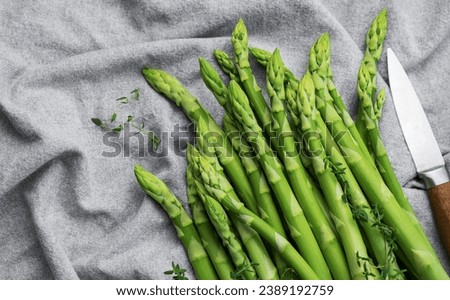 Similar – Image, Stock Photo Green asparagus Asparagus