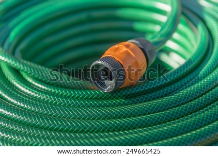 green water hose in orange connector