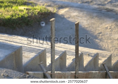 Similar – Image, Stock Photo Supported wooden beam, above which a window lets light into the building site.