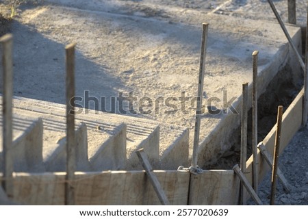 Similar – Image, Stock Photo Supported wooden beam, above which a window lets light into the building site.