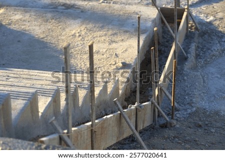 Similar – Image, Stock Photo Supported wooden beam, above which a window lets light into the building site.