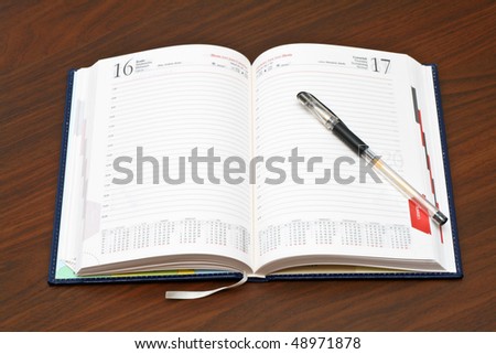 https://image.shutterstock.com/display_pic_with_logo/289861/289861,1268911433,1/stock-photo-diary-and-a-pen-on-wooden-table-48971878.jpg