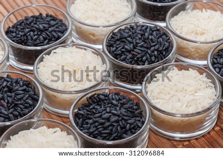 Bowls of white rice and black rice