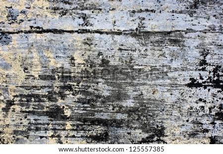 Scratched Black Yellow and Gray Paint on a Wall