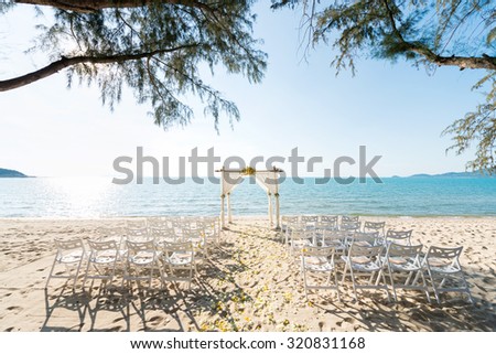 simple style wedding arch and decoration, venue, setup on tropical beach, outdoor beach wedding.