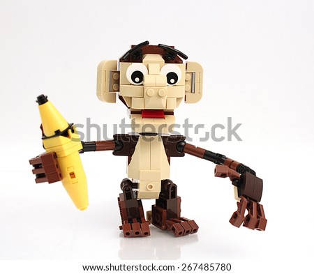 Colorado, USA - April 7, 2015: Studio shot of Lego monkey with banana. Legos are a popular line of plastic construction toys manufactured by The Lego Group, a company based in Denmark.