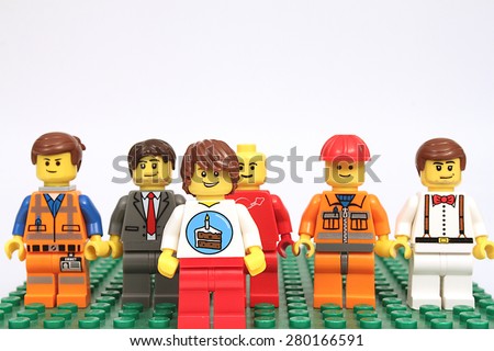 Colorado, USA - May 18, 2015: Studio shot of Lego minifigure birthday guy and friends. Legos are a popular line of plastic construction toys manufactured by The Lego Group, a company based in Denmark.