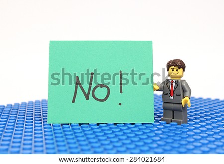 Colorado, USA - June 1, 2015: Studio shot of Lego minifigure with No! sign. Legos are a popular line of plastic construction toys manufactured by The Lego Group, a company based in Denmark.
