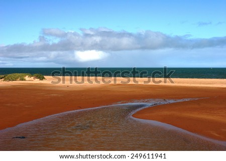 Red earthed estuary and ocean at Carnarvon Western Australia