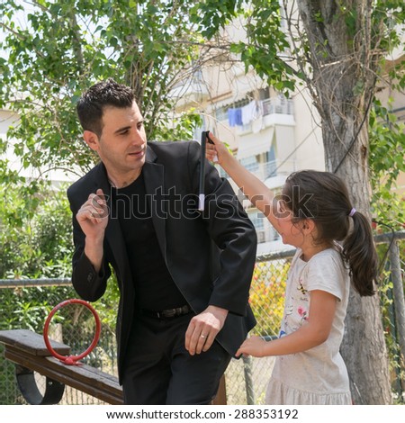 Date: 17/5/2015. Location: Park in Athens Greece. Magic trick wand falls down and brakes suddenly when the kid takes it at a Magic show.