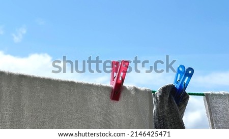 Dried towels, socks, clothespins up and blue sky Foto stock © 