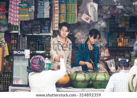 Mandalay, Myanmar - 19 February 2015 . The woman monger sell her goods.