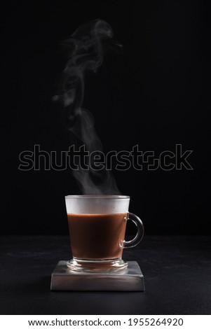 
Hot steaming coffee in a glass cup on black background ストックフォト © 