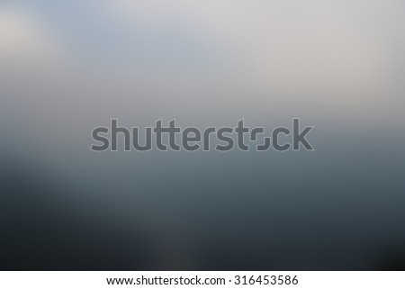 Blur background mountains under mist in the morning in the lower section of the Himalayan mountains in Kullu valley, Himachal Pradesh, India