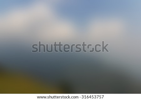Blur background mountains under mist in the morning in the lower section of the Himalayan mountains in Kullu valley, Himachal Pradesh, India