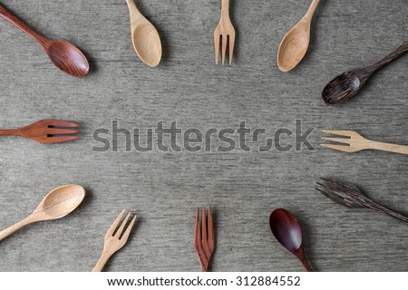 Wood spoon on wood board background