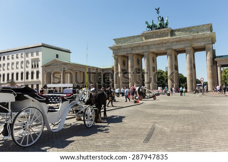 Berlin, Germany, June 11, 2015: Horse carriage in front of Brandenburg Gate in Berlin, Germany.