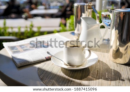 Photo of Morning Coffee On Cafe Table In The Sun