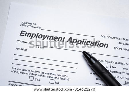 Completing an job application form with focus on heading