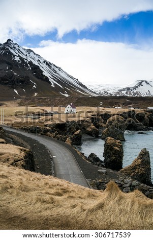Iceland, June 2015. Iceland coast line against gigantic mountains.