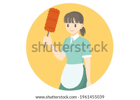 Housekeeper in uniform holding the feather duster in hand. Isolated on yellow background.