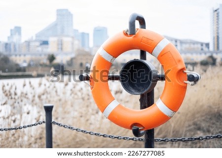Similar – Image, Stock Photo Red white barrier chain disappears in green hedge
