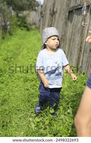 Similar – Image, Stock Photo Portrait of boy walking on the beach in winter