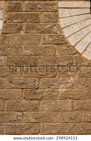 Background of brick wall texture with bright bricks laid in semicircle