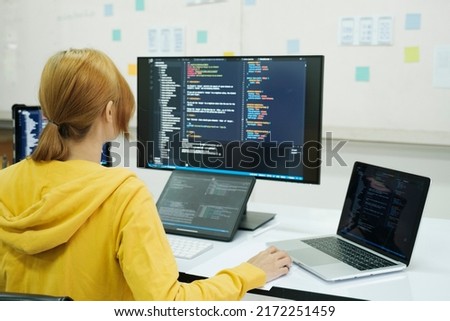 Programmer is coding and programming software. business woman working on computer in the office. ストックフォト © 