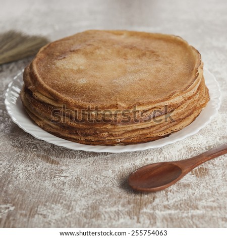Russian pancakes with wooden spoon. Russian cuisine. Taste pancake. Bake