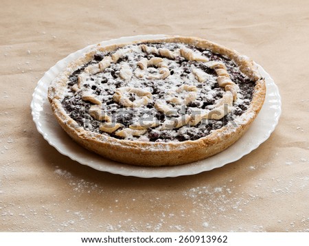 Blackberry and blueberry pie. black currant pie in vanilla powder. Powdered sugar. Blackberry cake on desk. Bake with vanilla powder. Bake