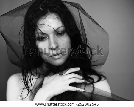 Black veil woman. Black voile lady. Brunette girl. Portrait face white young woman. Emotions