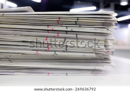 Newspapers stacked